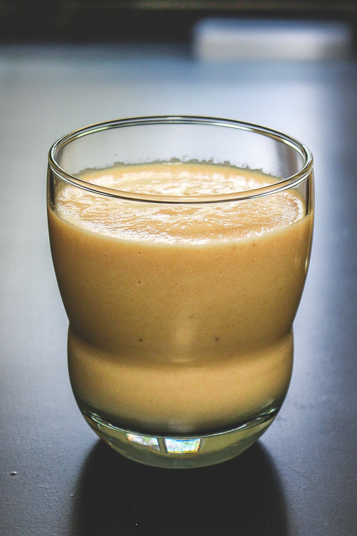 Chikoo milksgake served in the glass.