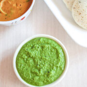 Green coconut chutney served with idli and sambar.