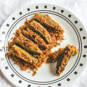 Bharwa bhindi served in a white plate.