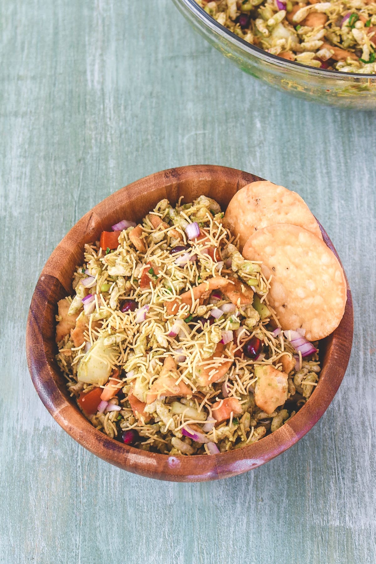 Bhel puri served with 2 papdi on the side.