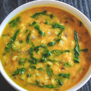 Spinach dal served in a white bowl.