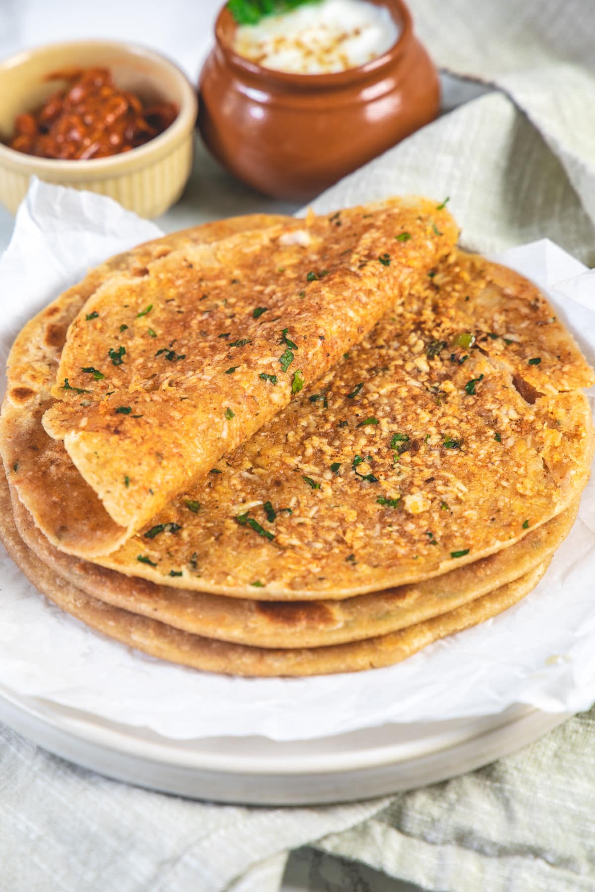 Paneer paratha cut open to show the stuffing.