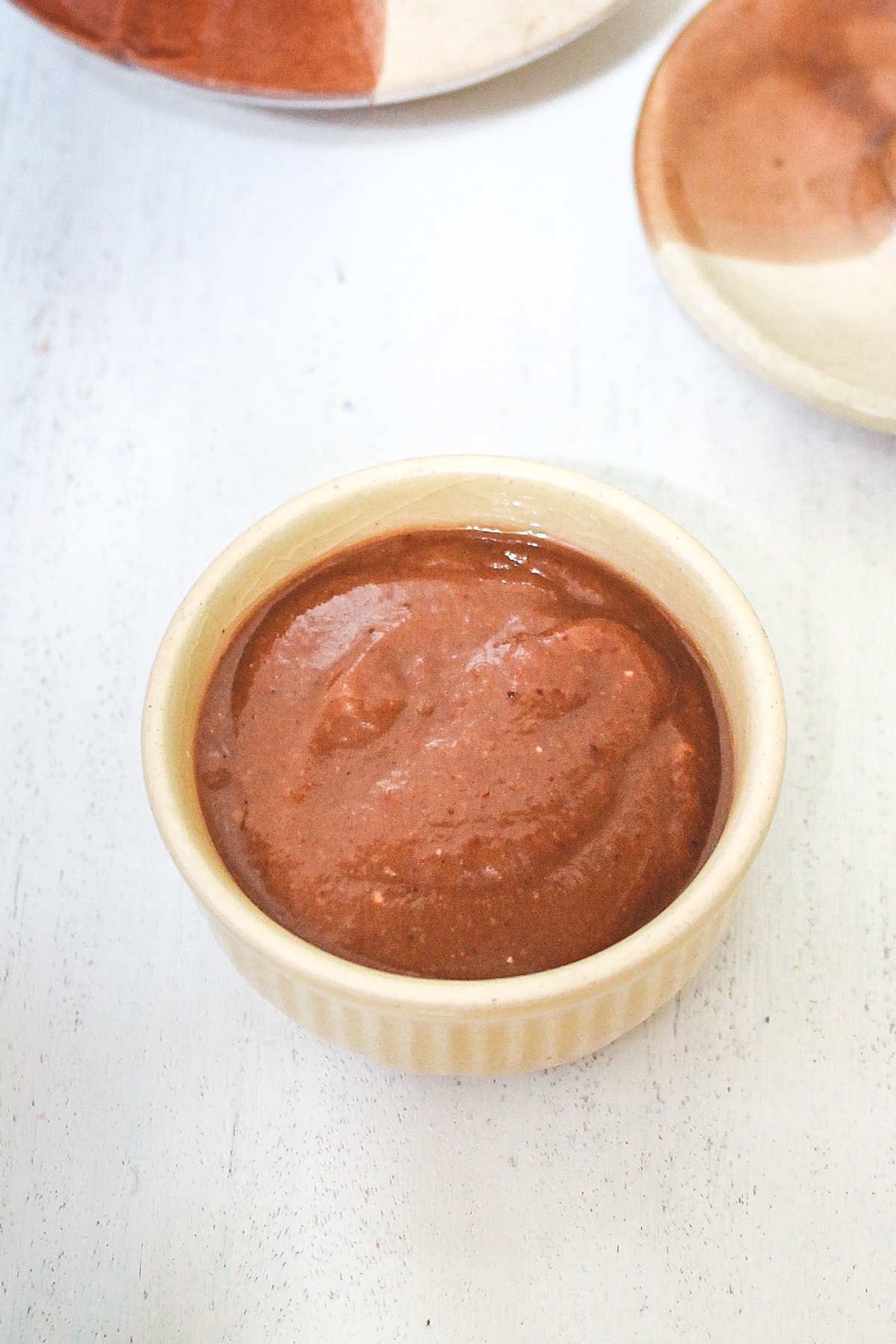 Meethi chutney served in a small bowl.