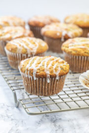 Lemon poppy seed muffins on a cooling rack.