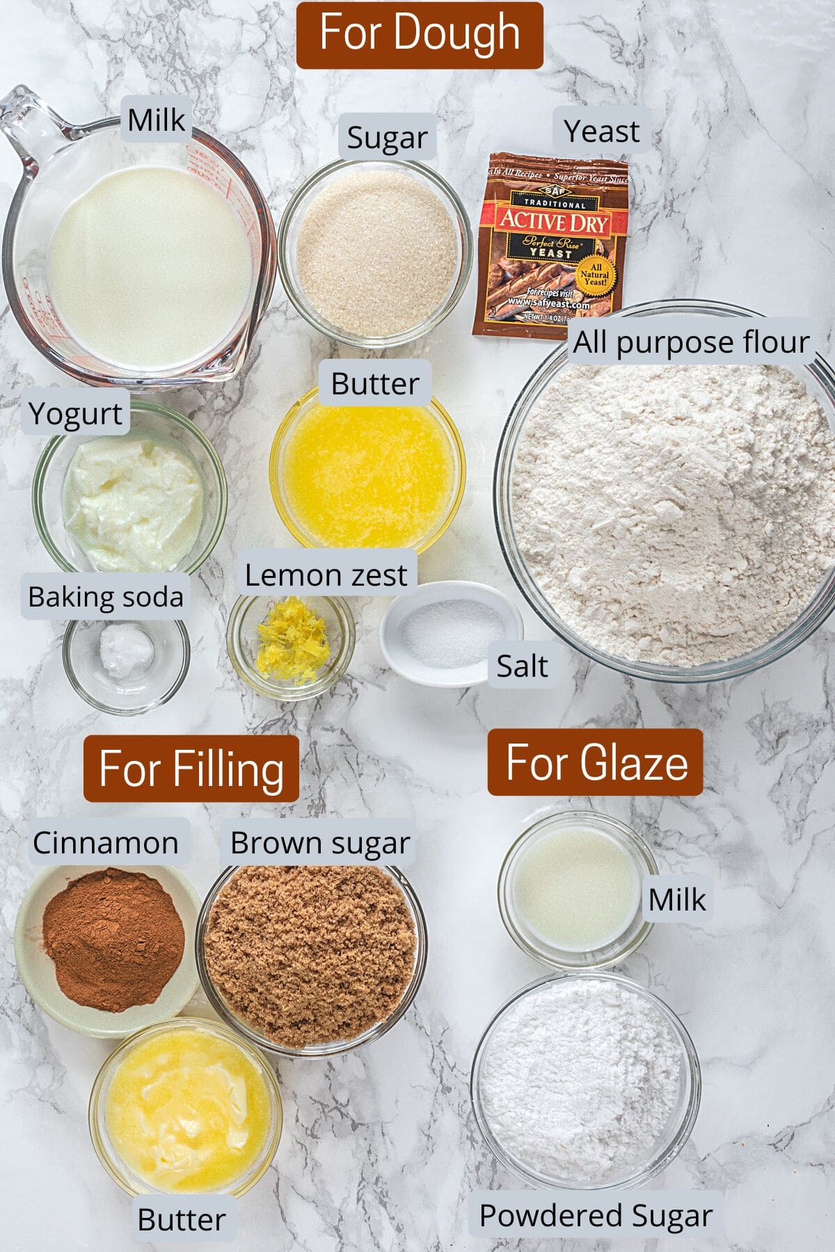 Eggless cinnamon roll ingredients in bowls with labels.