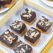 6 pieces of chocolate barfi into a box.