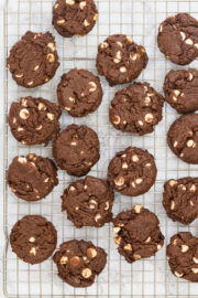 Eggless chocolate cookies are on a cooling rack.