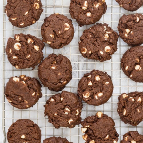 Eggless chocolate cookies are on a cooling rack.