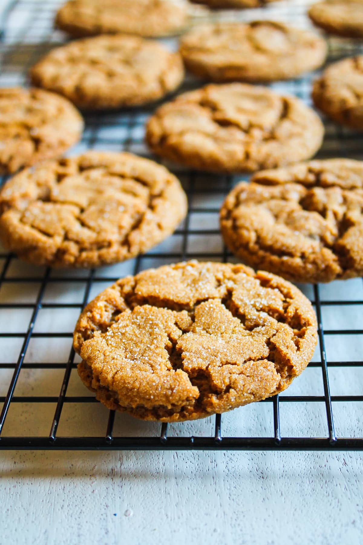 Eggless gingersnap cookies on a cooling rack.