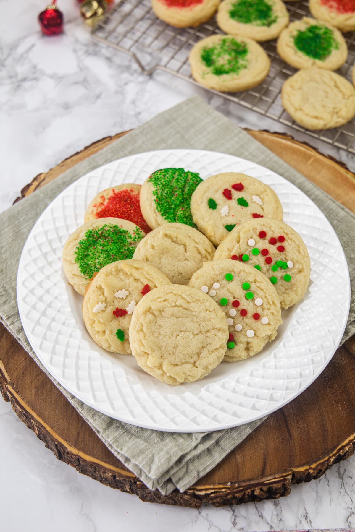 Eggless sugar cookies in a plate with napkin under the plate.