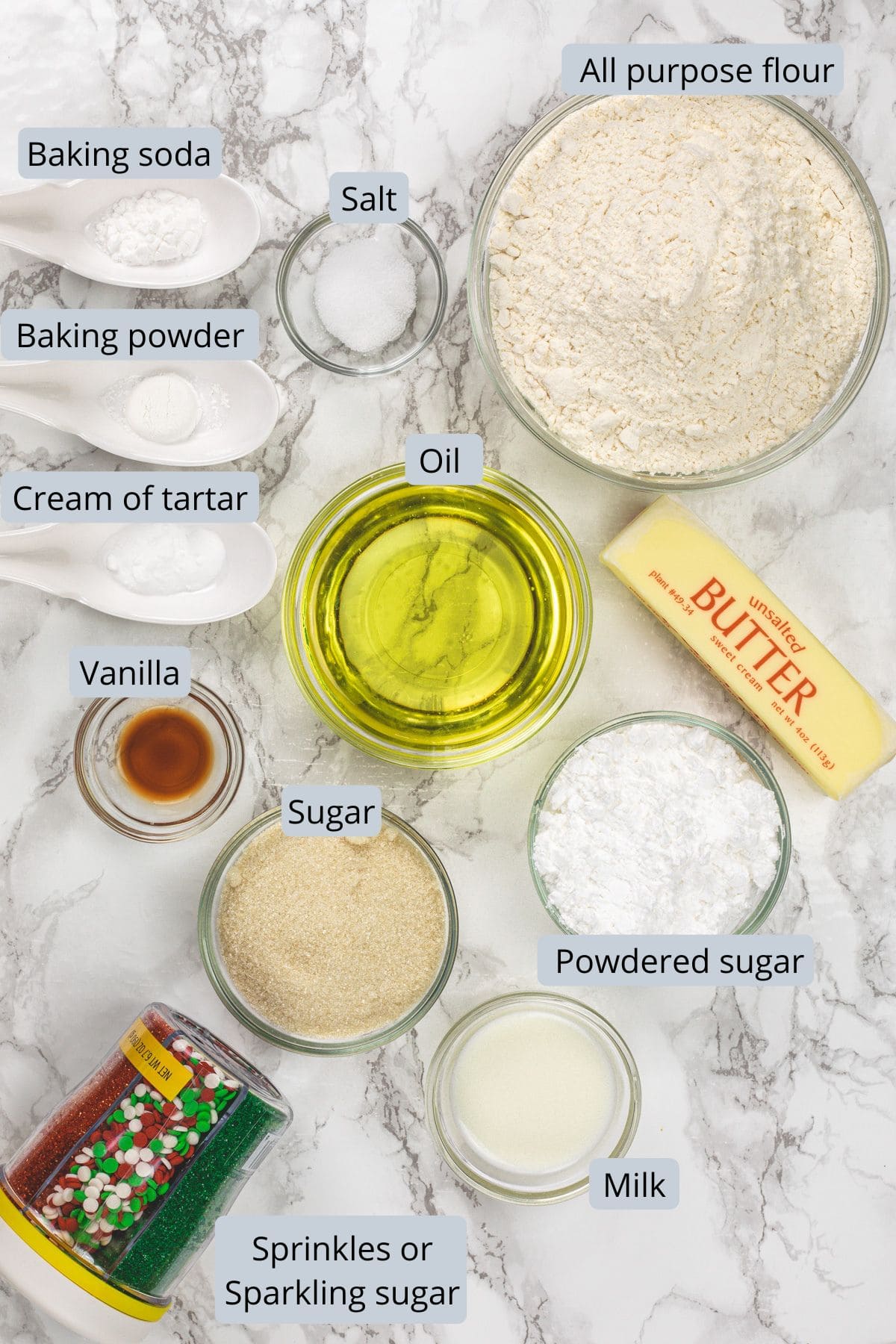 Eggless sugar cookie ingredients in bowls and spoons with labels.