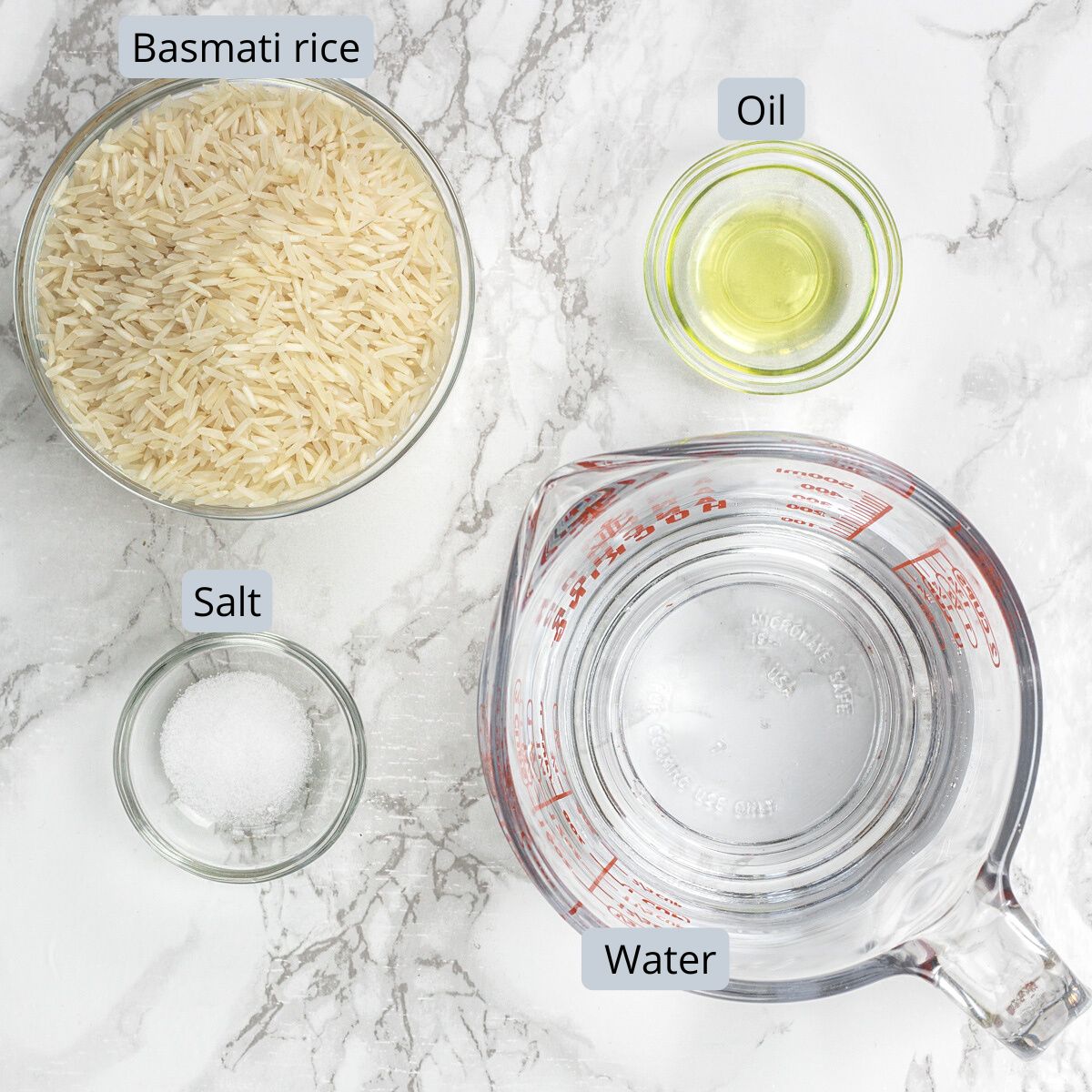 Instant pot basmati rice ingredients in bwols and cup with labels.