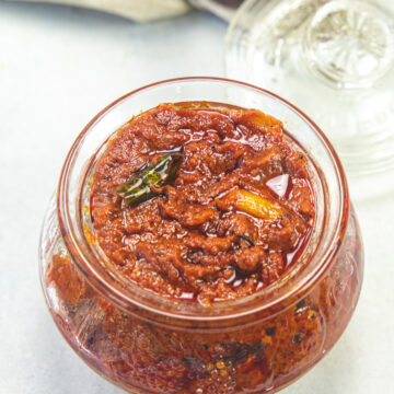 Tomato pickle in a glass jar.