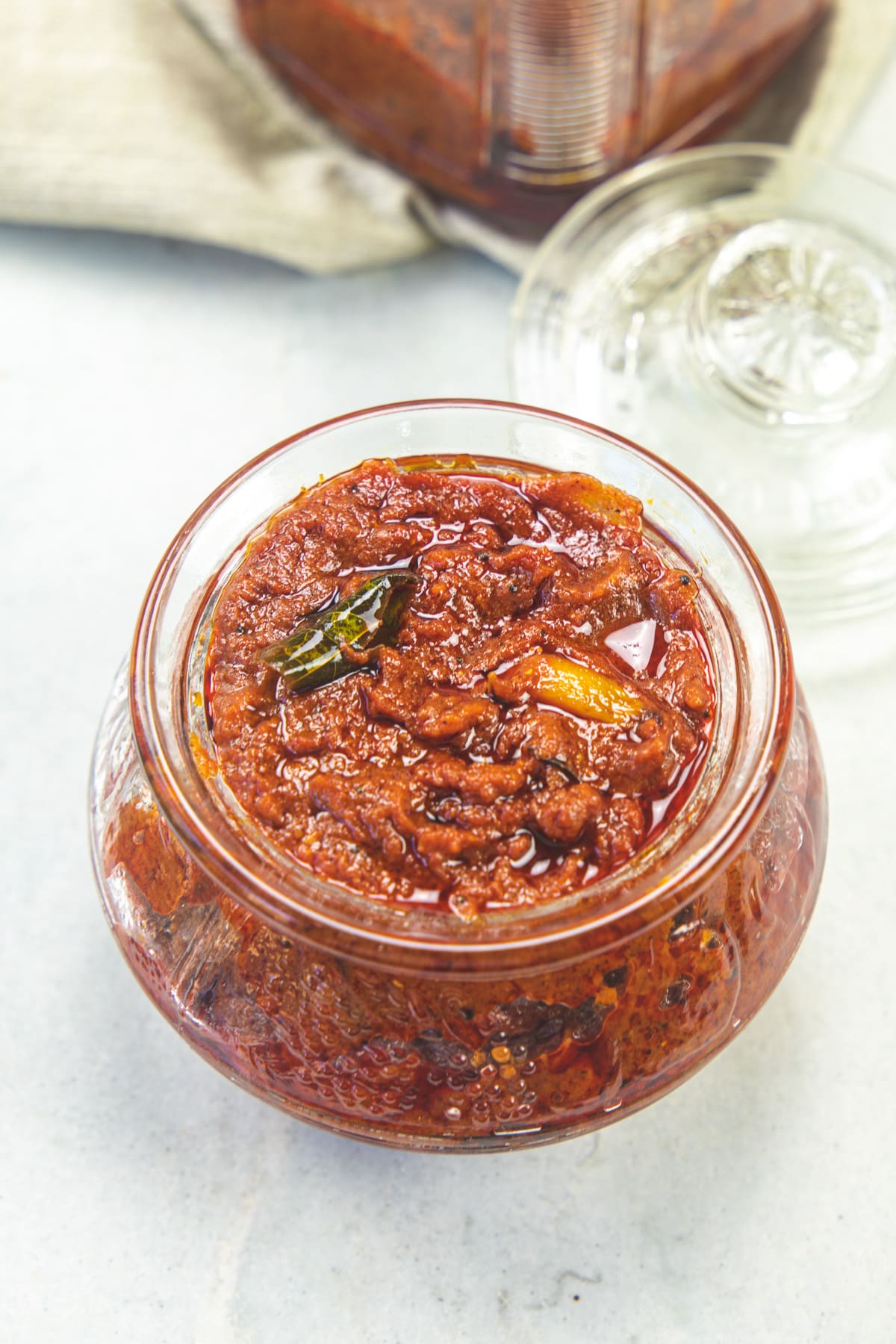 Tomato pickle in a glass jar.