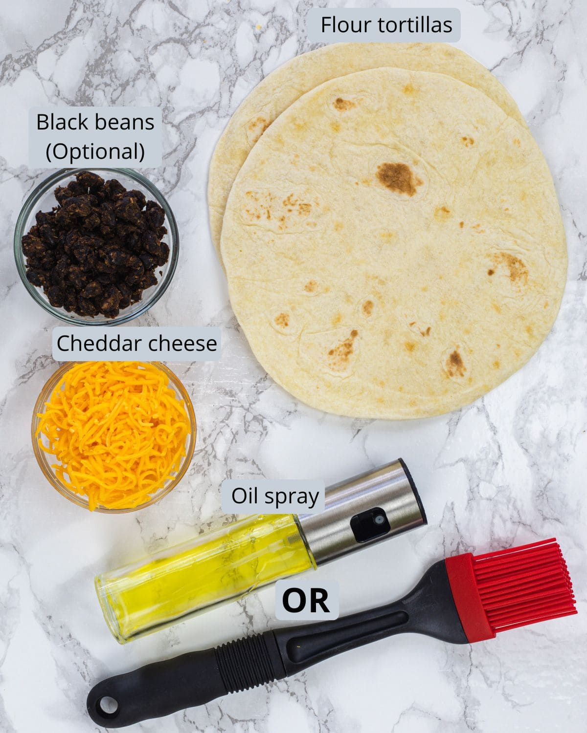 Air fryer quesadillas ingredients in bowl and marble surface with labels.