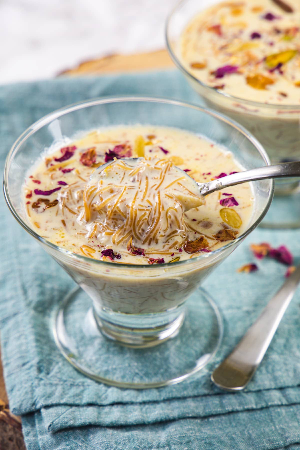 A spoonful of sheer khurma taking from the bowl.