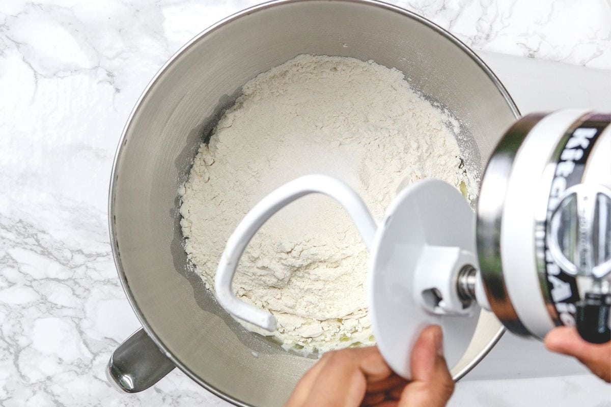 Attaching the dough hook on the machine.