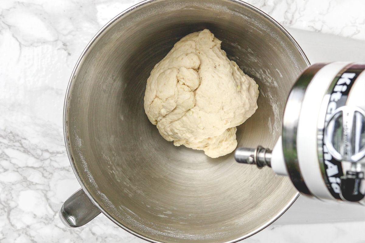 Ready dough ball in a mixer bowl.
