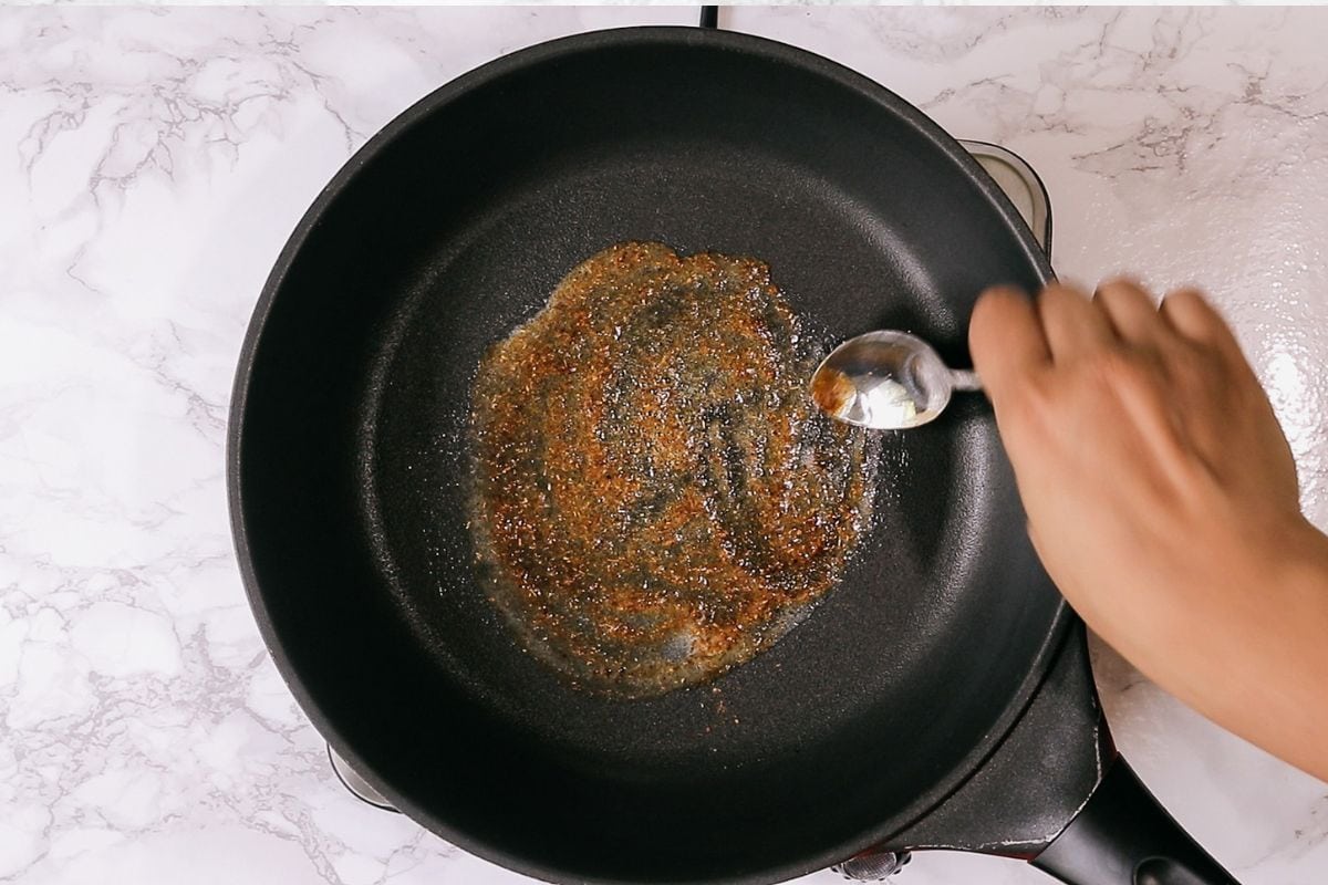 Melting butter and pav bhaji masala.