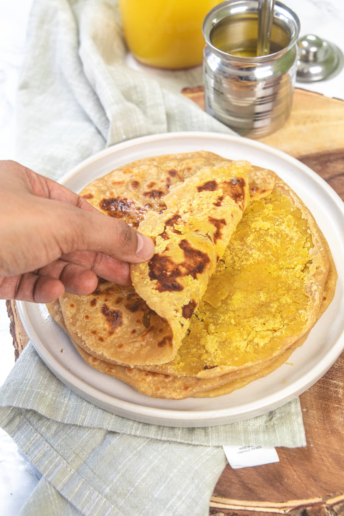 Showing inside stuffing on puran poli.