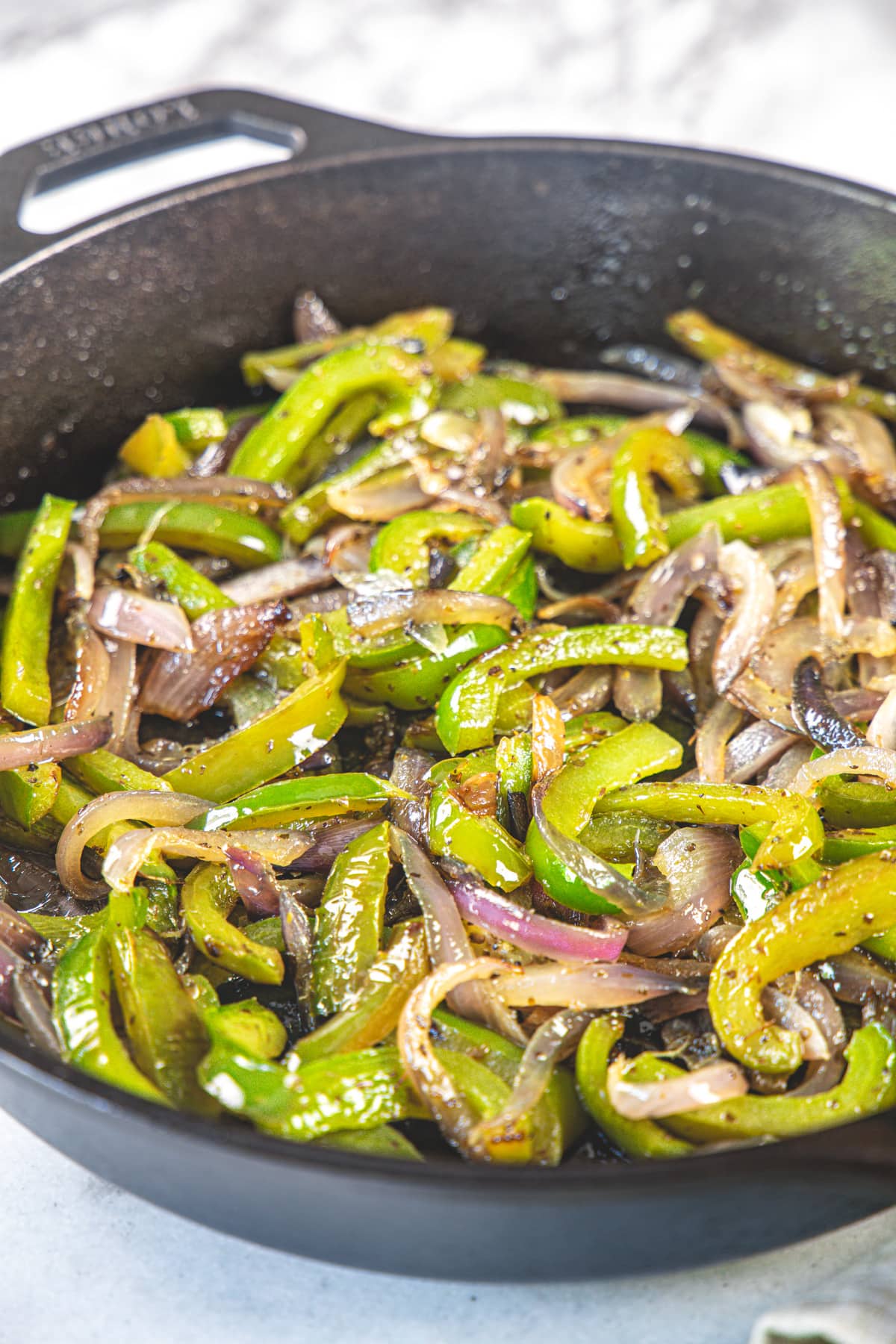 Fajita veggies in cast iron pan.