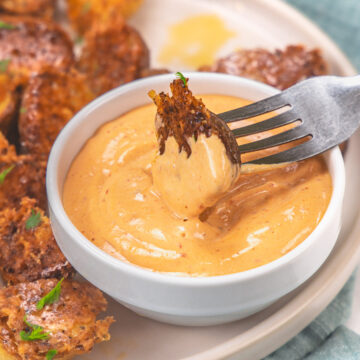 Dipping a potato piece into the chipotle mayo.