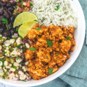 Chipotle sofritas served as a burrito bowl with rice, salsa, black beans and corn salsa.