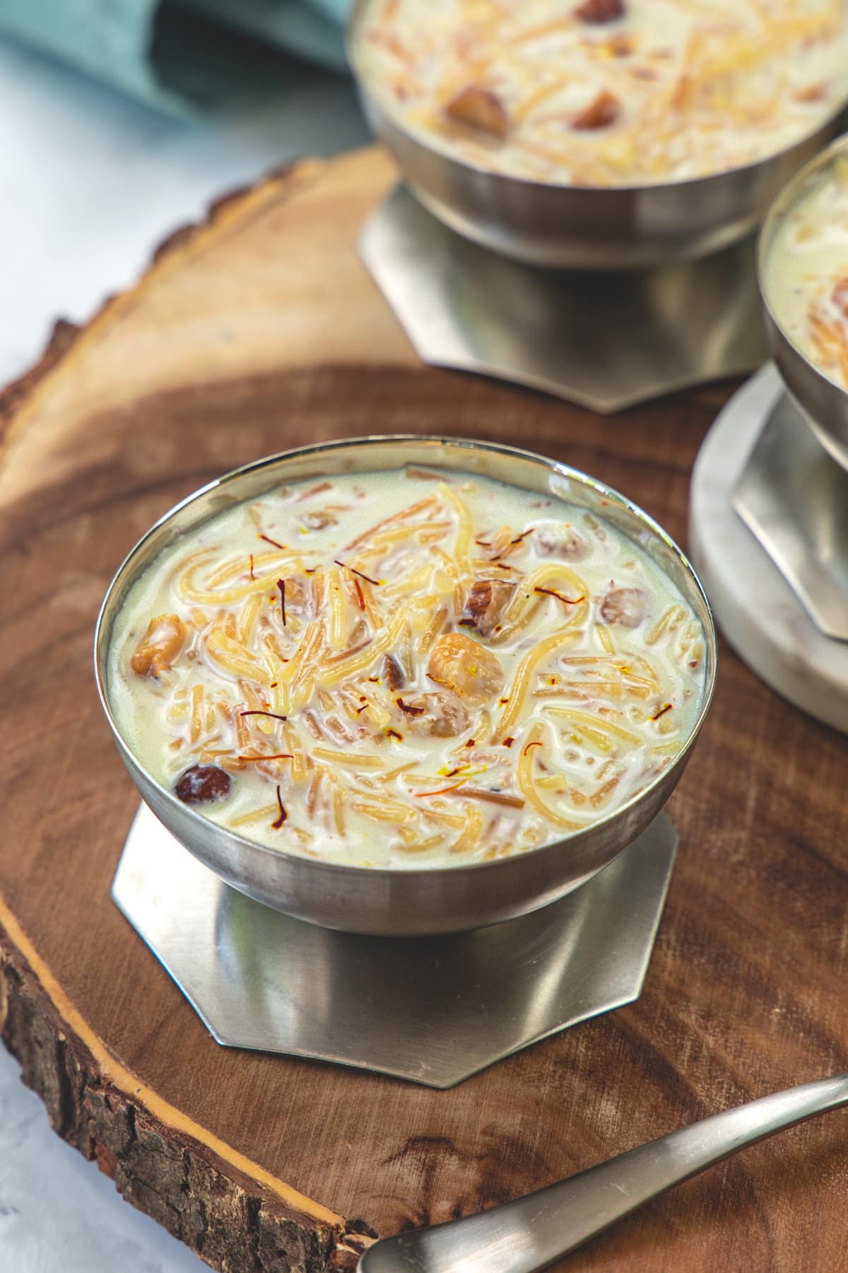 Semiya payasam in a bowl on a wooden board.