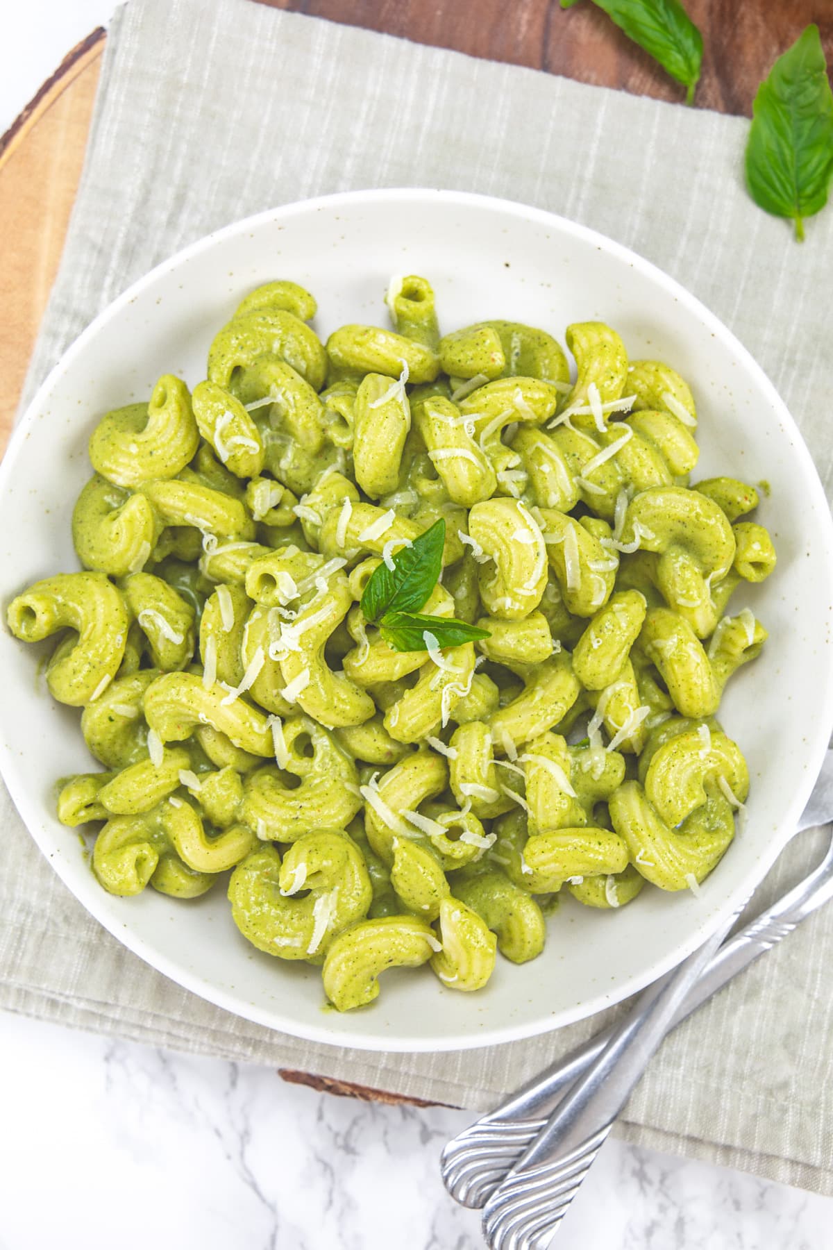 Zucchini pasta plate with forks on the side and napkin under the plate.