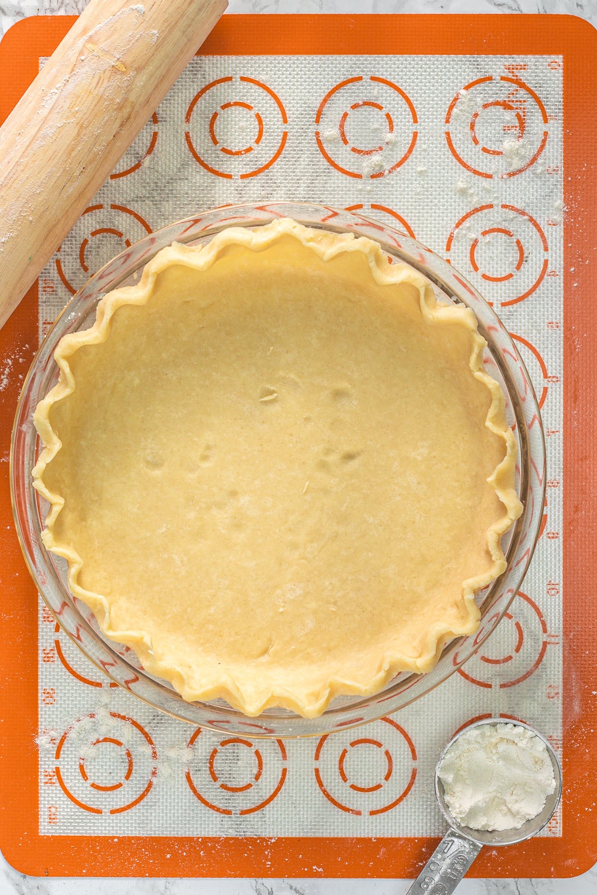 Unbaked food processor pie crust in 9-inch pie plate.