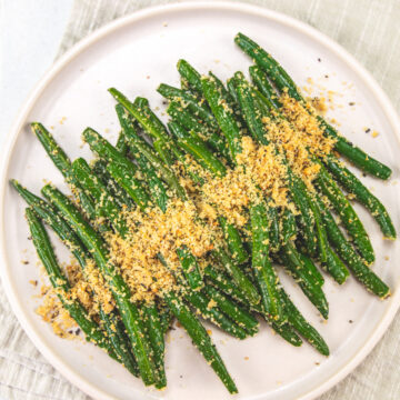 Italian green beans served in a plate with napkin under it.