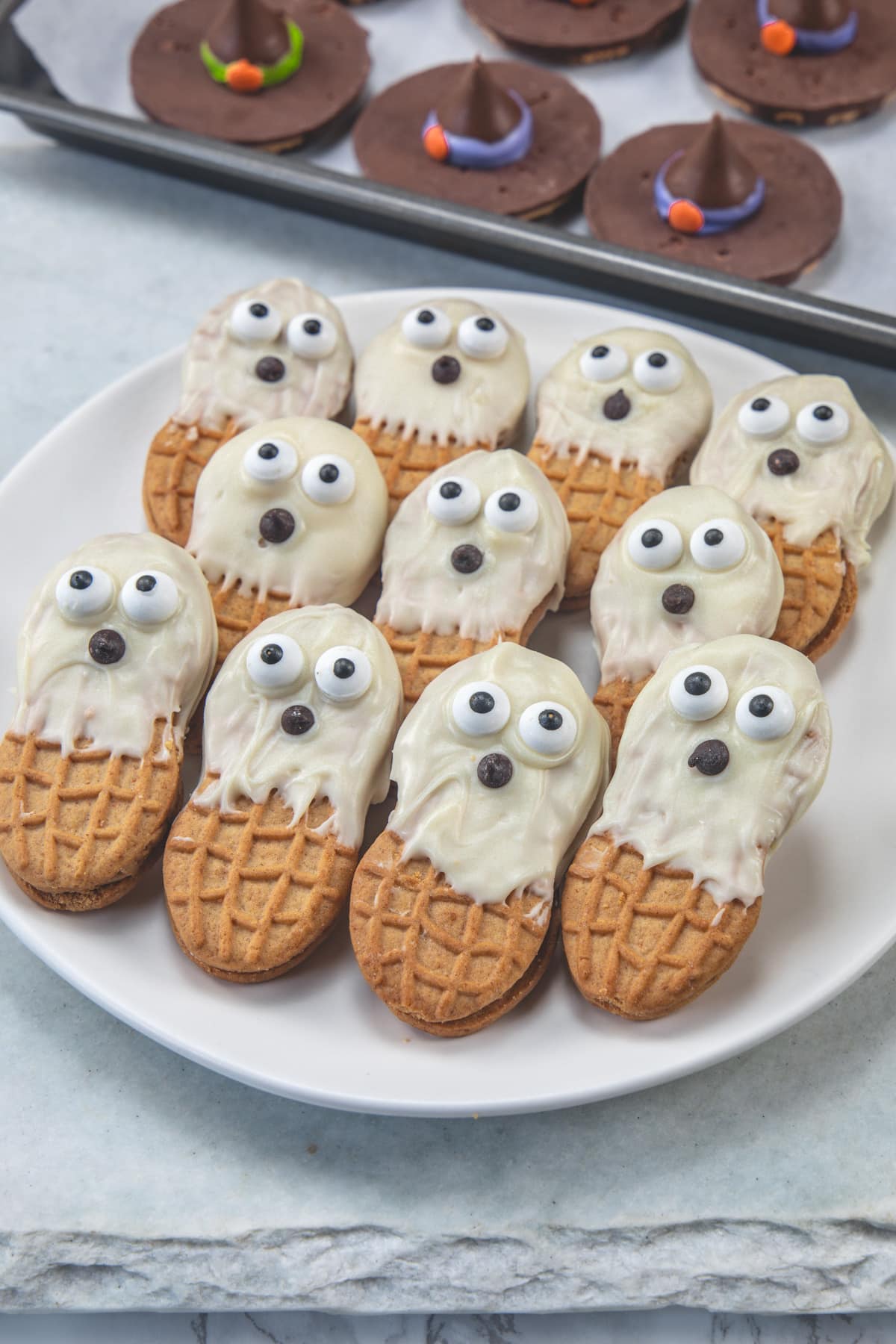 Ghost cookies in a white plate