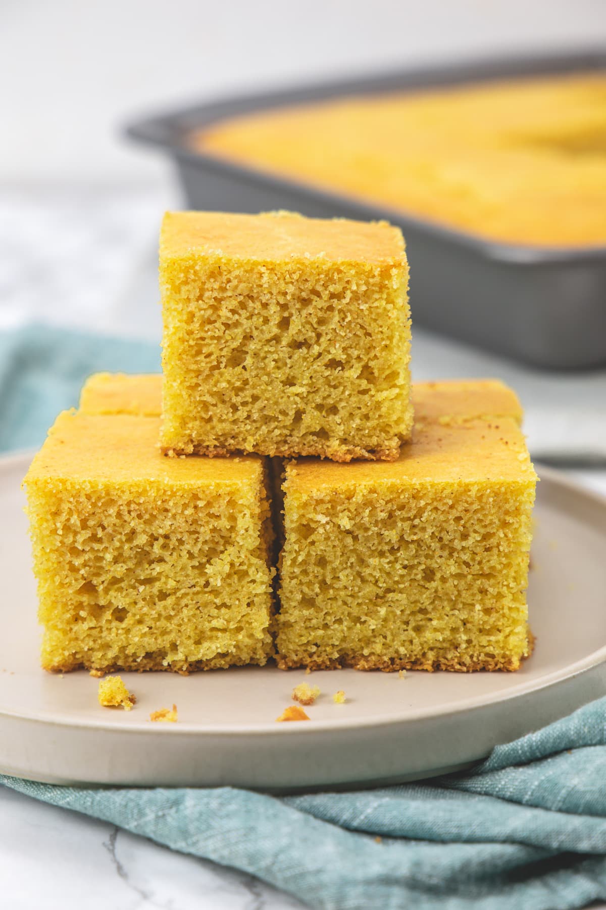 3 pieces of eggless cornbread on a plate.