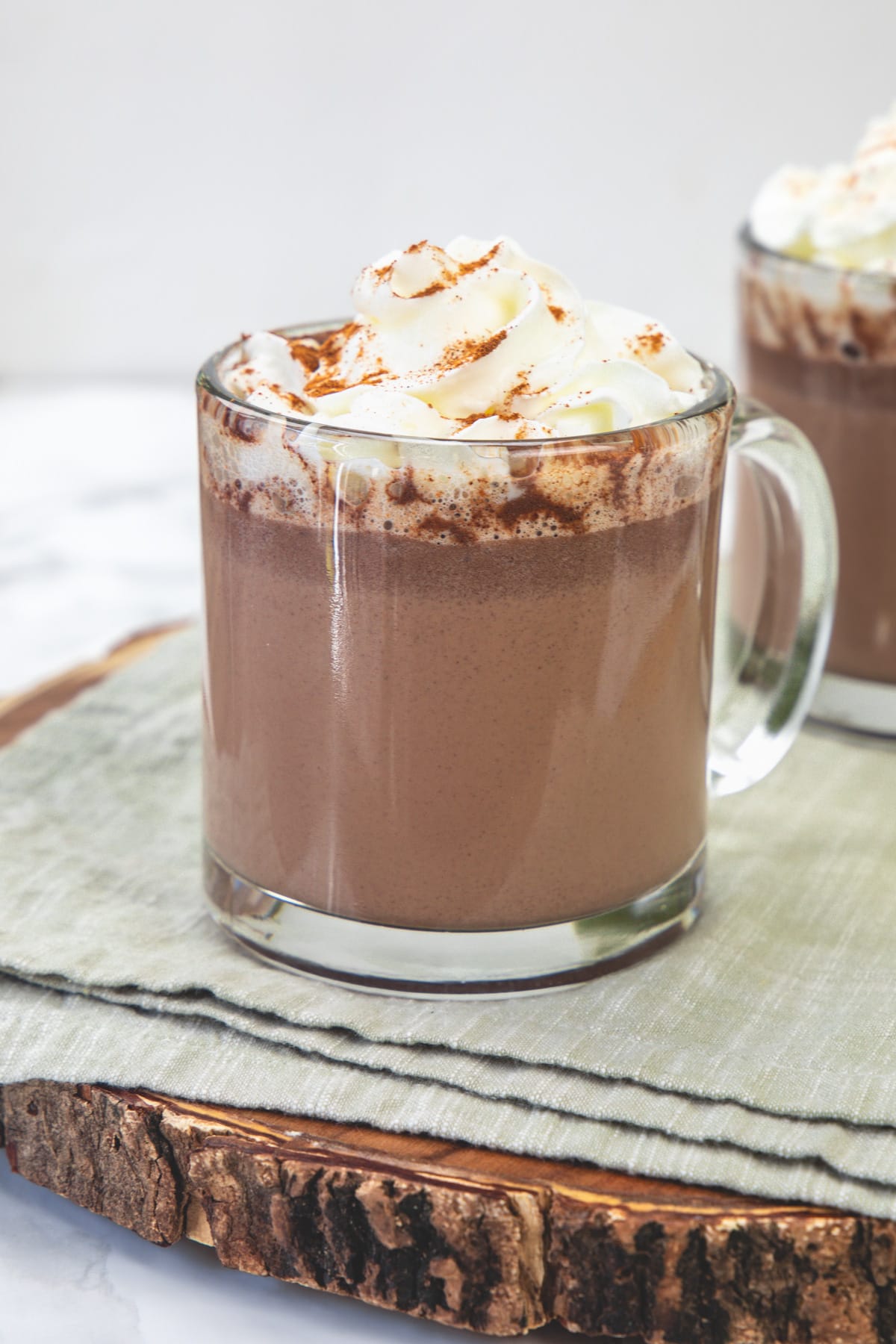 A glass of Mexican mocha on a wooden board.