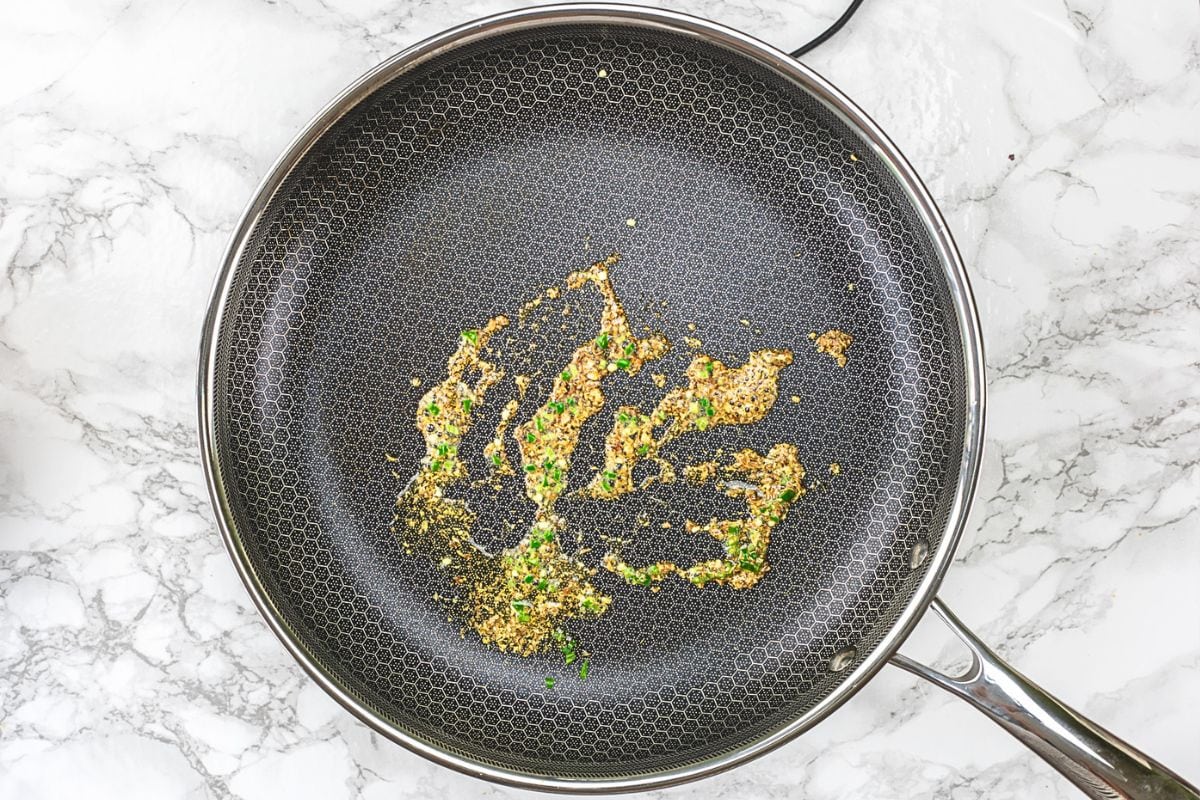 Sauteing green chilies in the oil.