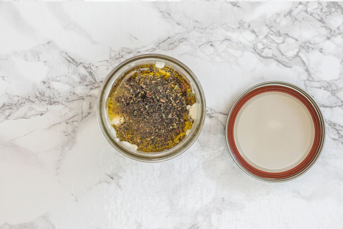 Olive garden salad dressing ingredients in a mason jar.