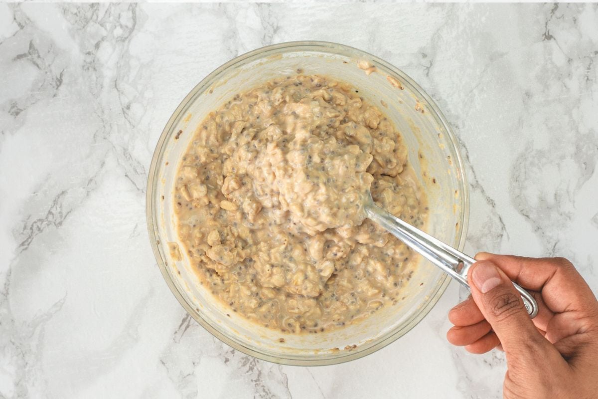Showing an overnight rested oats texture with spoon.