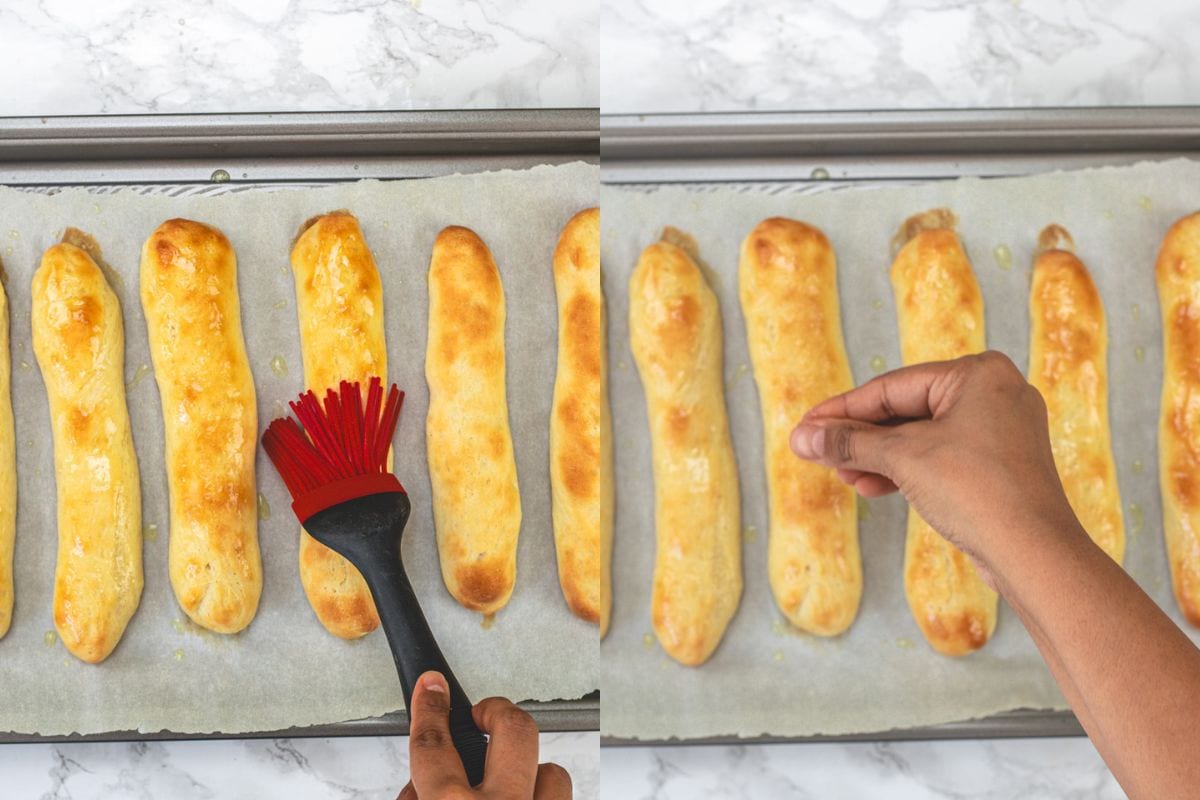 Brushing with garlic butter and sprinkling salt.