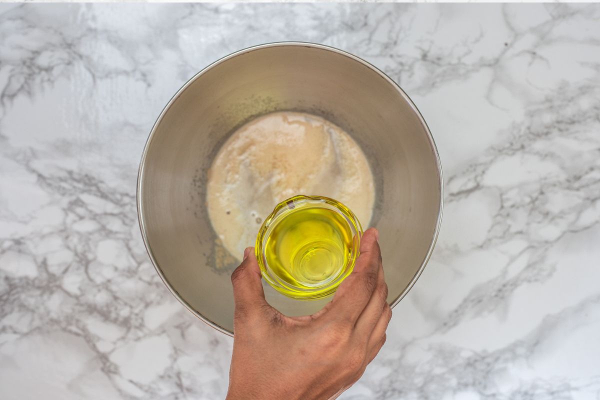 Adding oil to the bloomed yeast.