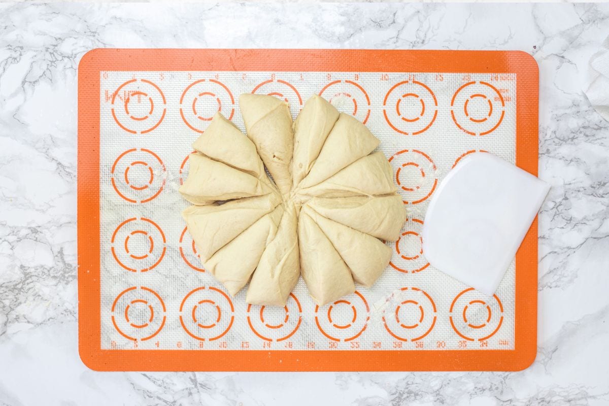 Dough divided into 12 equal parts.